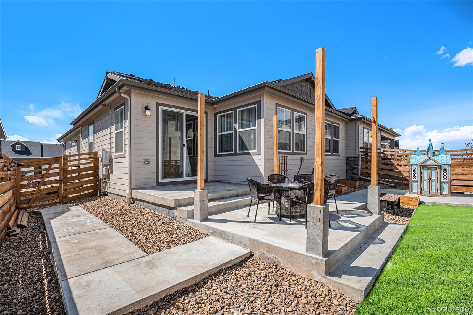 3522 North Buchanan Way Aurora, CO 80019 - Photo 29 of 30 a front view of a house with garden