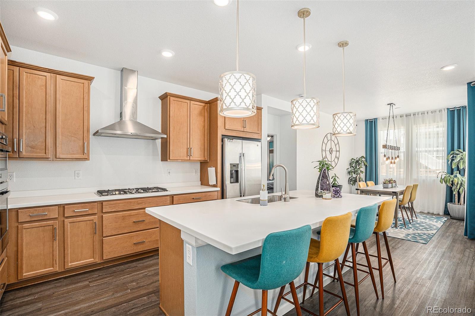 3522 North Buchanan Way Aurora, CO 80019 - Photo 5 of 30 a view of a dining room with furniture window and wooden floor