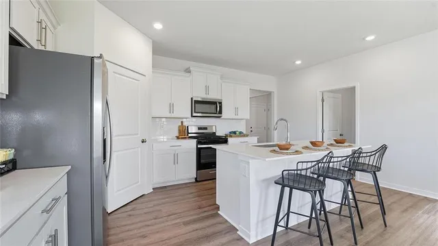 $444,990 | 713 Fallen Leaf Drive, Belton, MO 64012