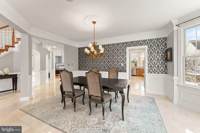 a large kitchen with a large window and stainless steel appliances