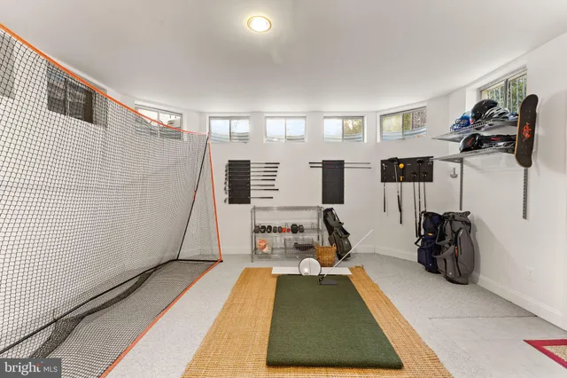a view of a swimming pool in he middle of the green field