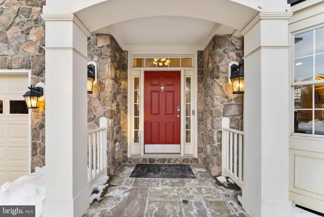 a view of a white house with a yard