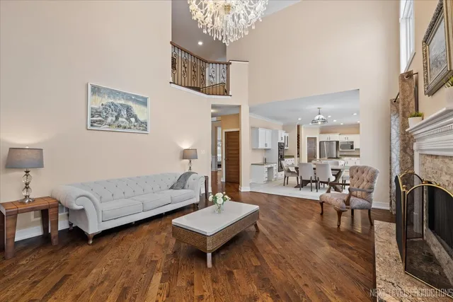 a living room with a couch and wooden floor
