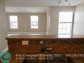 1020 Crystal Way, Unit D Delray Beach, FL 33444 - Photo 12 of 24 a view of a bath room with window