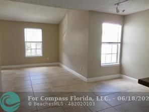 1020 Crystal Way, Unit D Delray Beach, FL 33444 - Photo 16 of 24 a view of an empty room with a window
