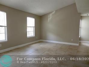 1020 Crystal Way, Unit D Delray Beach, FL 33444 - Photo 22 of 24 an empty room with a window