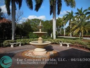 1020 Crystal Way, Unit D Delray Beach, FL 33444 - Photo 4 of 24 a view of a house with garden