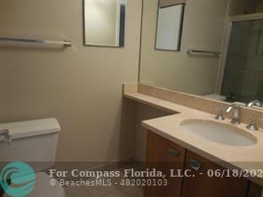 1020 Crystal Way, Unit D Delray Beach, FL 33444 - Photo 9 of 24 a bathroom with a sink and a toilet