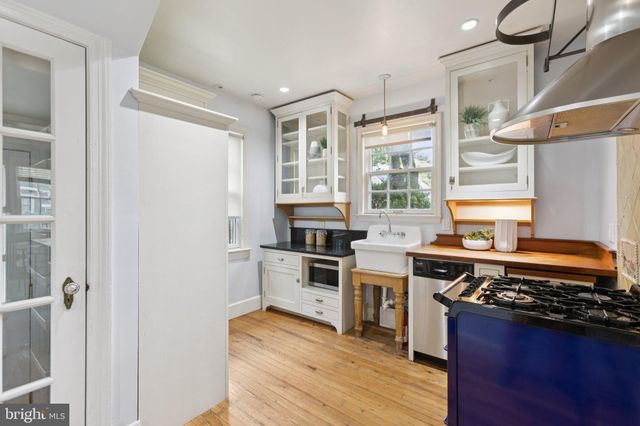 a kitchen with stainless steel appliances granite countertop a stove and a refrigerator