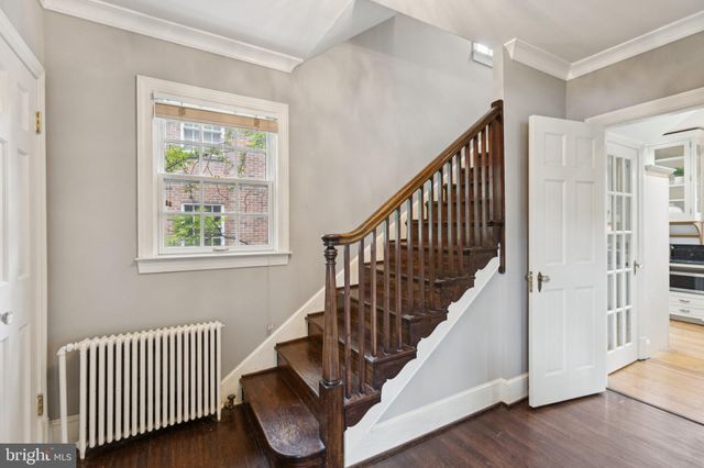 a view of entryway with wooden floor and stairs