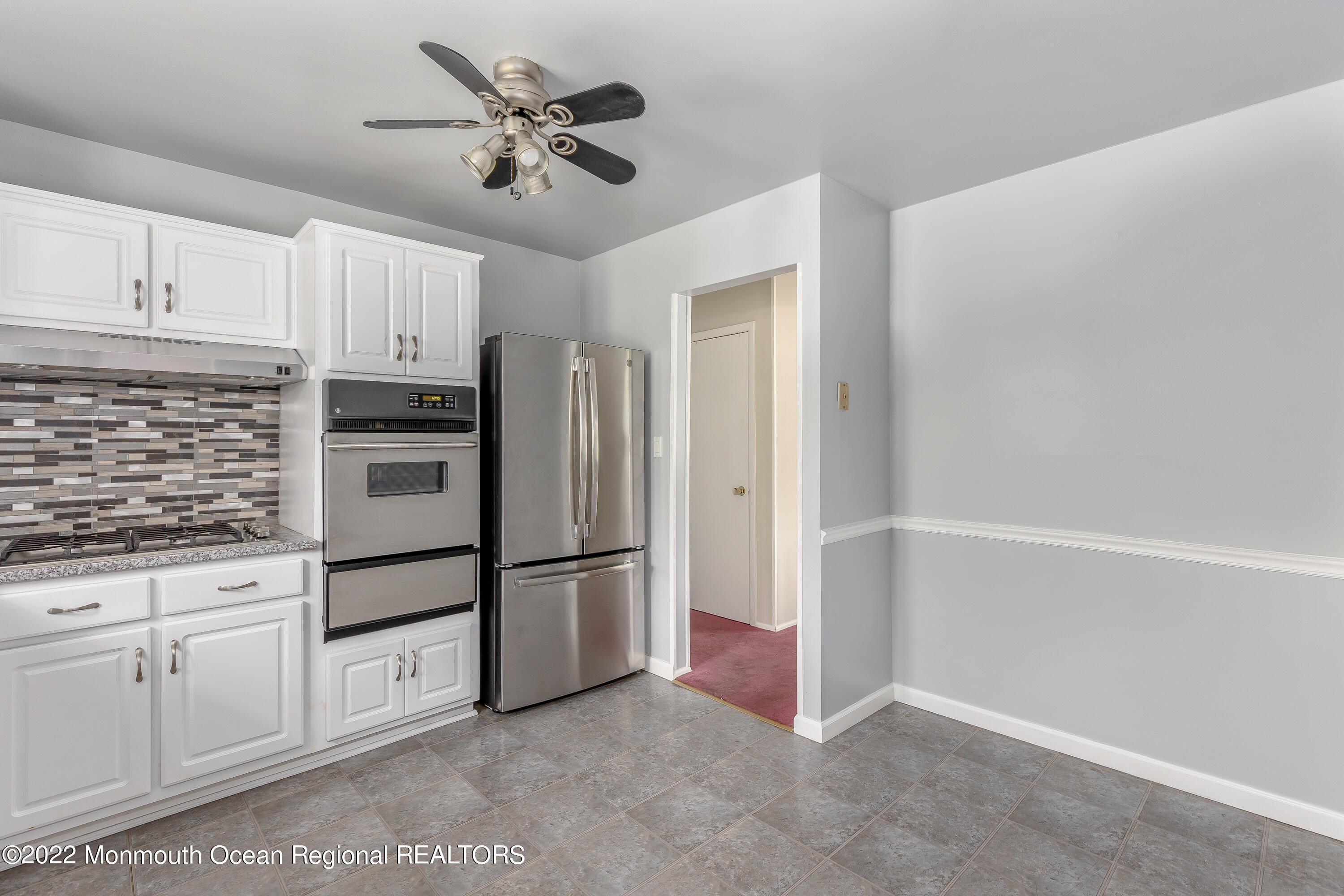 37 Westbrook Road Howell, NJ 07731 - Photo 11 of 39 a kitchen with granite countertop a refrigerator and cabinets