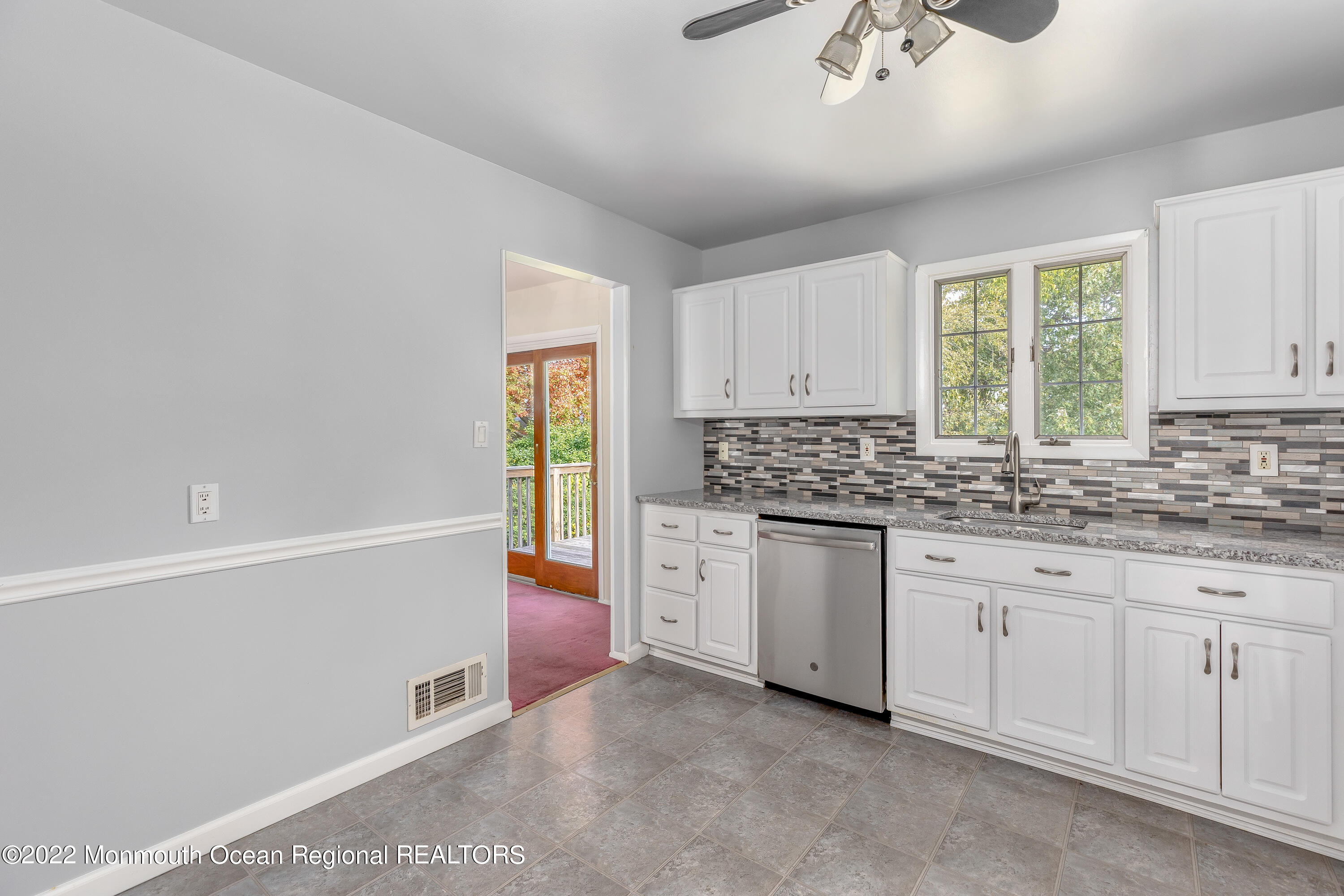 37 Westbrook Road Howell, NJ 07731 - Photo 12 of 39 a kitchen with granite countertop white cabinets and white appliances