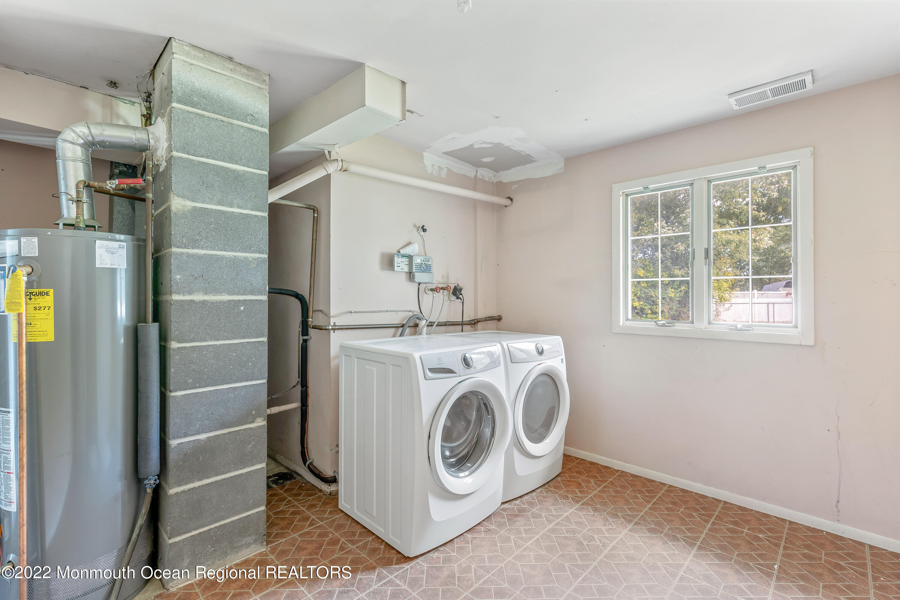 37 Westbrook Road Howell, NJ 07731 - Photo 26 of 39 a utility room with dryer and washer