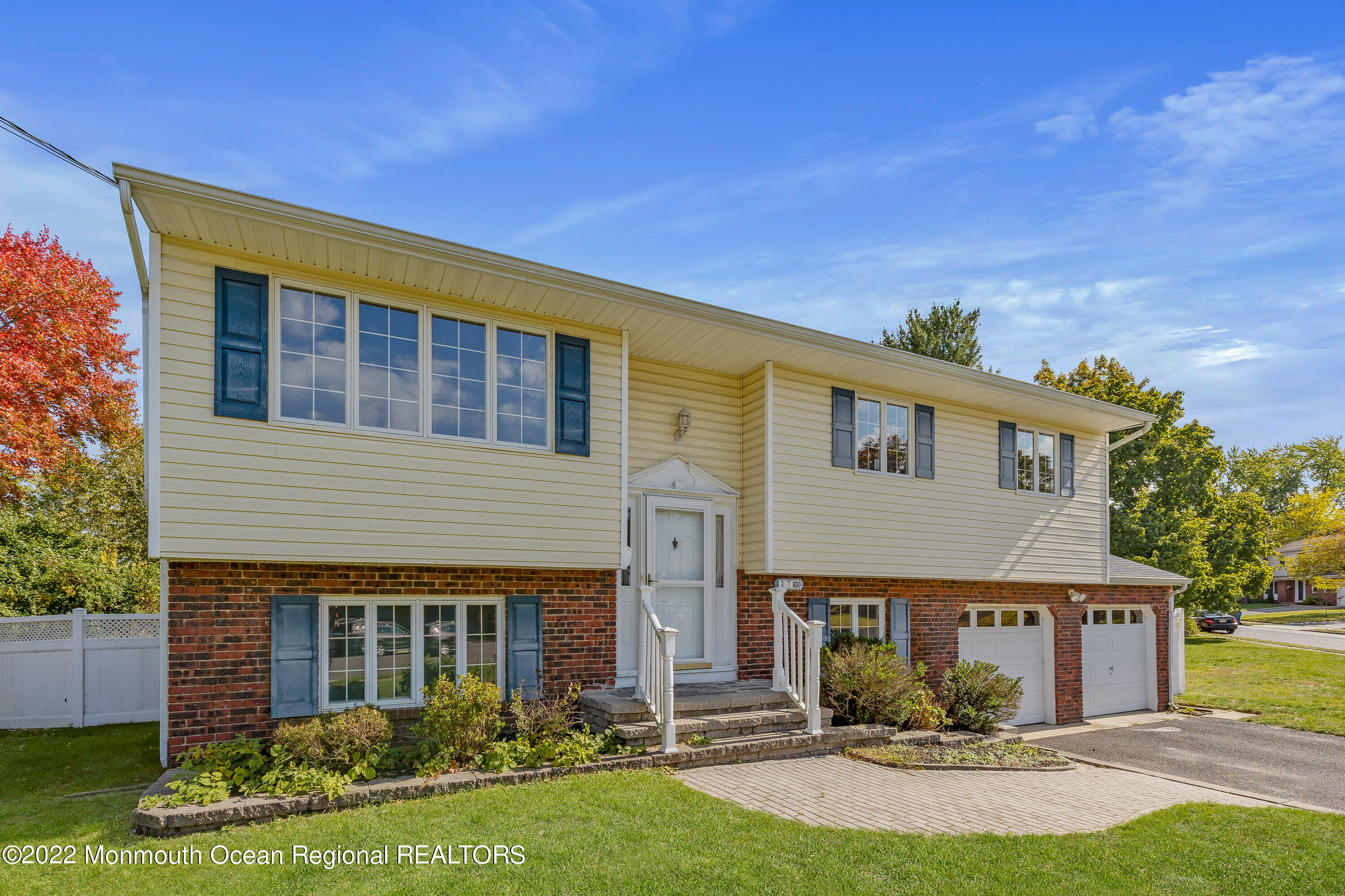 37 Westbrook Road Howell, NJ 07731 - Photo 4 of 39 a front view of a house with a yard and garage