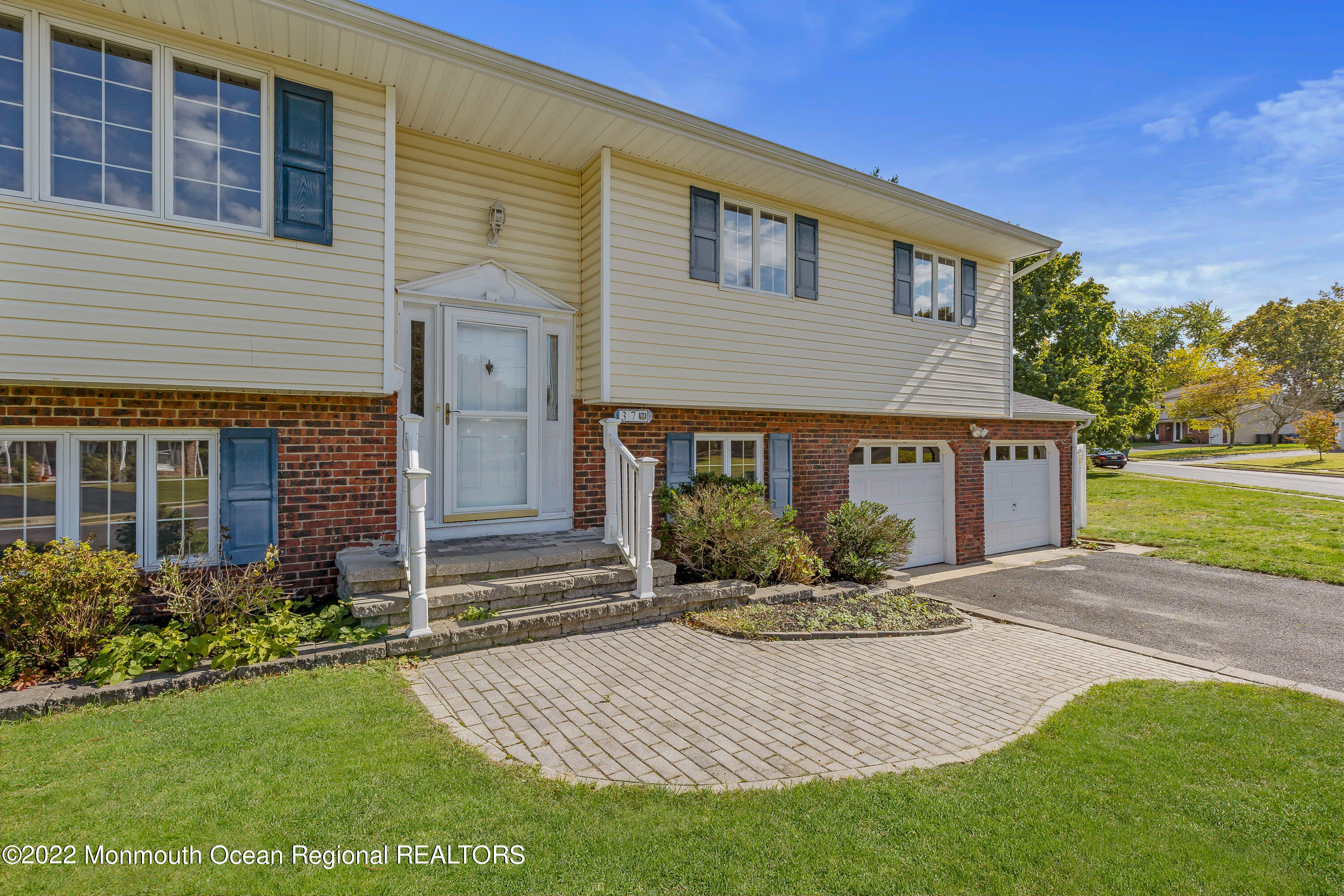 37 Westbrook Road Howell, NJ 07731 - Photo 5 of 39 a front view of house with yard and green space