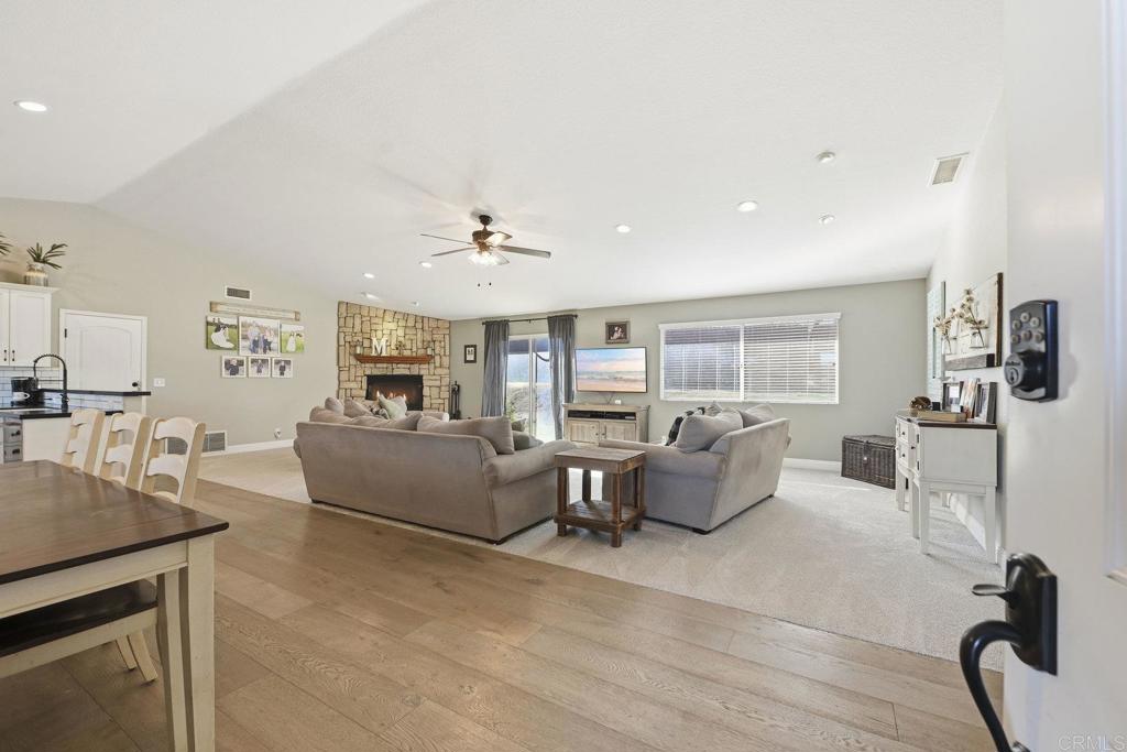 13638 West Oak Glen Road Valley Center, CA 92082 - Photo 11 of 30 a living room with furniture and white walls
