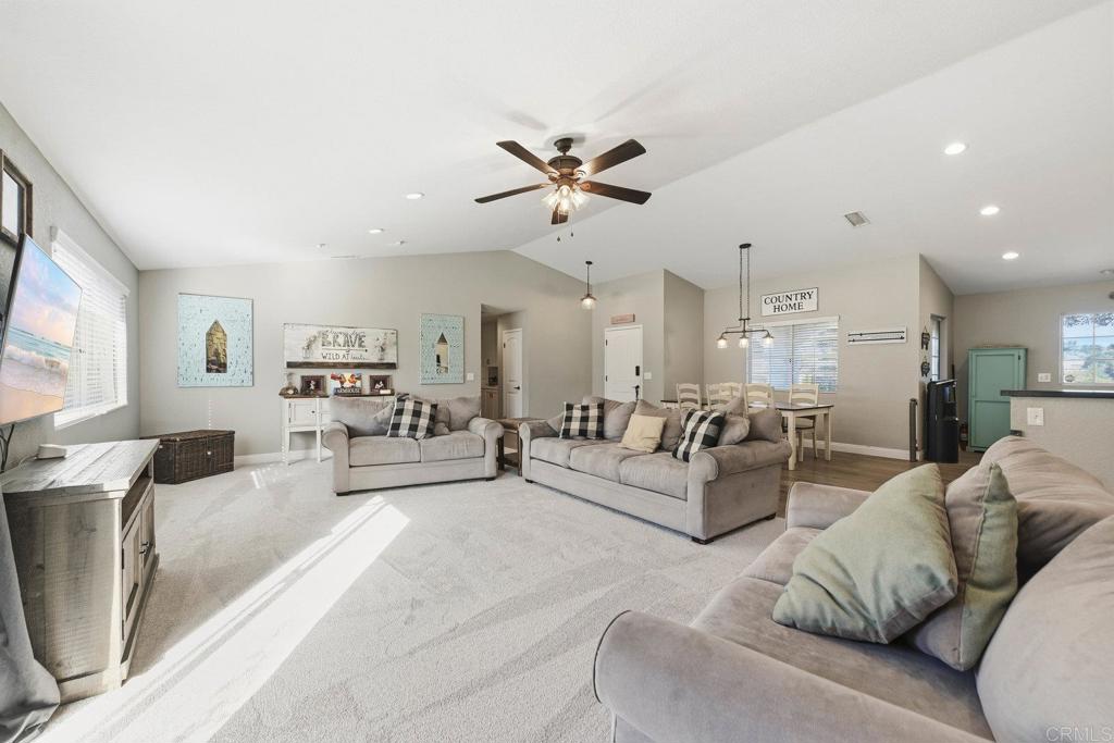 13638 West Oak Glen Road Valley Center, CA 92082 - Photo 12 of 30 a living room with furniture and a flat screen tv