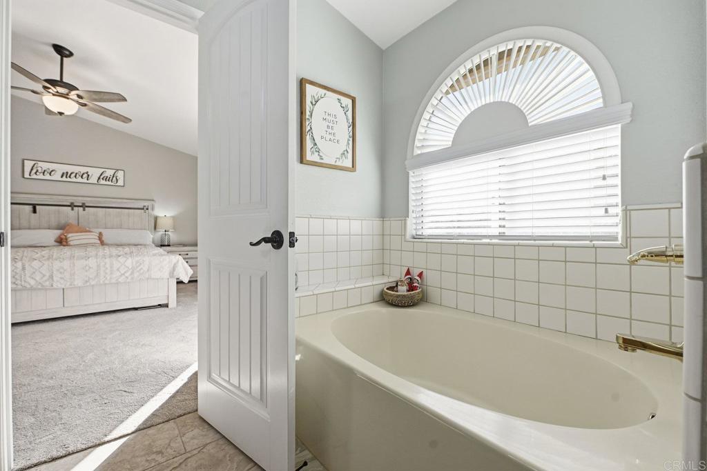 13638 West Oak Glen Road Valley Center, CA 92082 - Photo 21 of 30 a bathroom with a bathtub and a shower