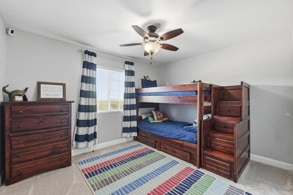 13638 West Oak Glen Road Valley Center, CA 92082 - Photo 22 of 30 a bedroom with a bed and a dresser
