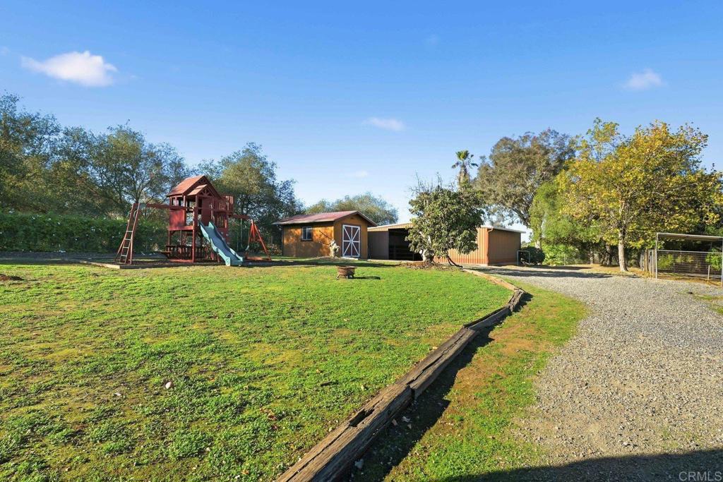 13638 West Oak Glen Road Valley Center, CA 92082 - Photo 5 of 30 a front view of a house with garden