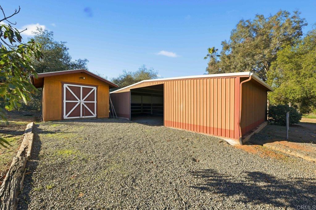 13638 West Oak Glen Road Valley Center, CA 92082 - Photo 6 of 30 a front view of a house with a yard