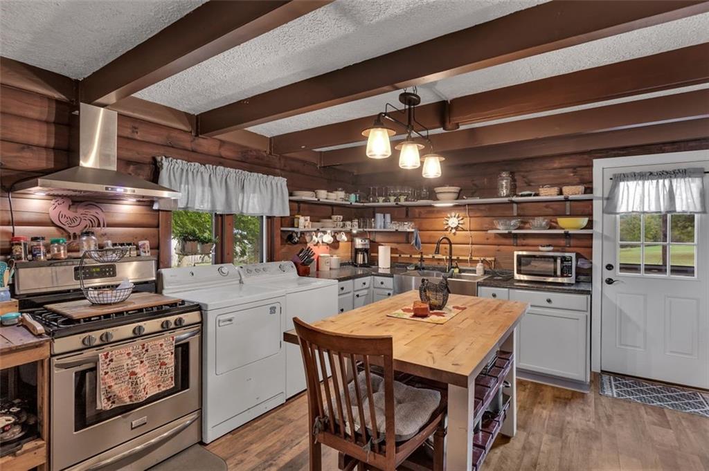 1270 Old State Road Apollo, PA 15613 - Photo 23 of 36 a kitchen with a stove a table and chairs
