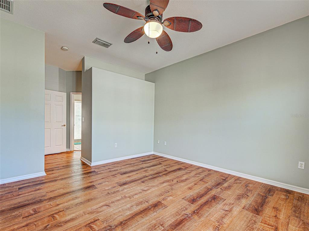 1801 Highland Road Osprey, FL 34229 - Photo 21 of 40 a view of empty room with wooden floor