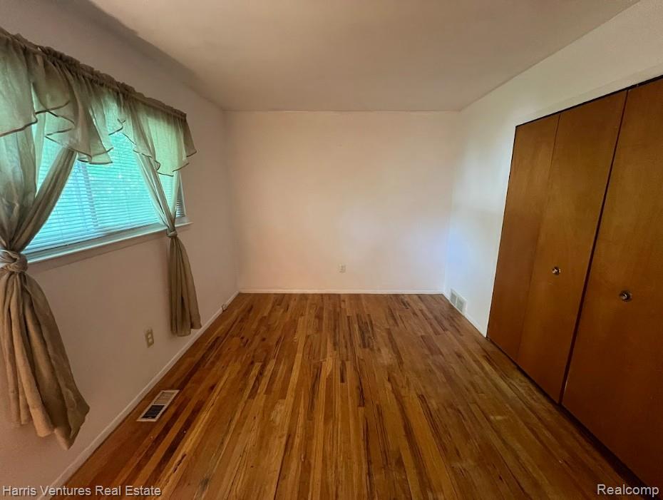 28482 Sutherland Avenue Warren, MI 48088 - Photo 18 of 25 Bedroom #3 featuring wood-finish flooring, white walls, and a window with blinds