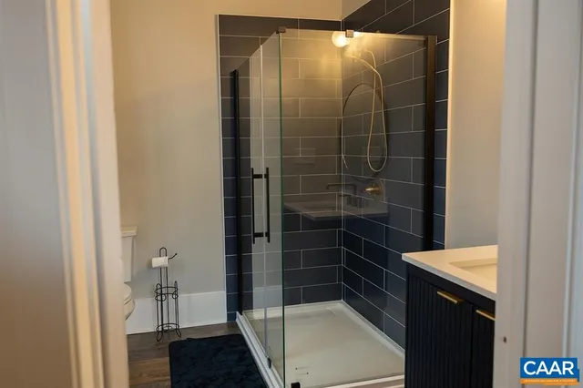 a living room with furniture or couch and a flat screen tv