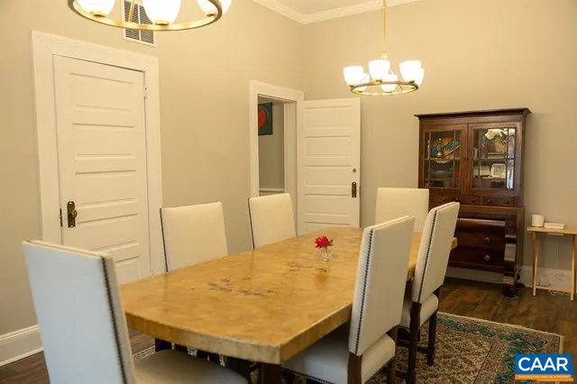 a living room with furniture wooden floor and a fireplace