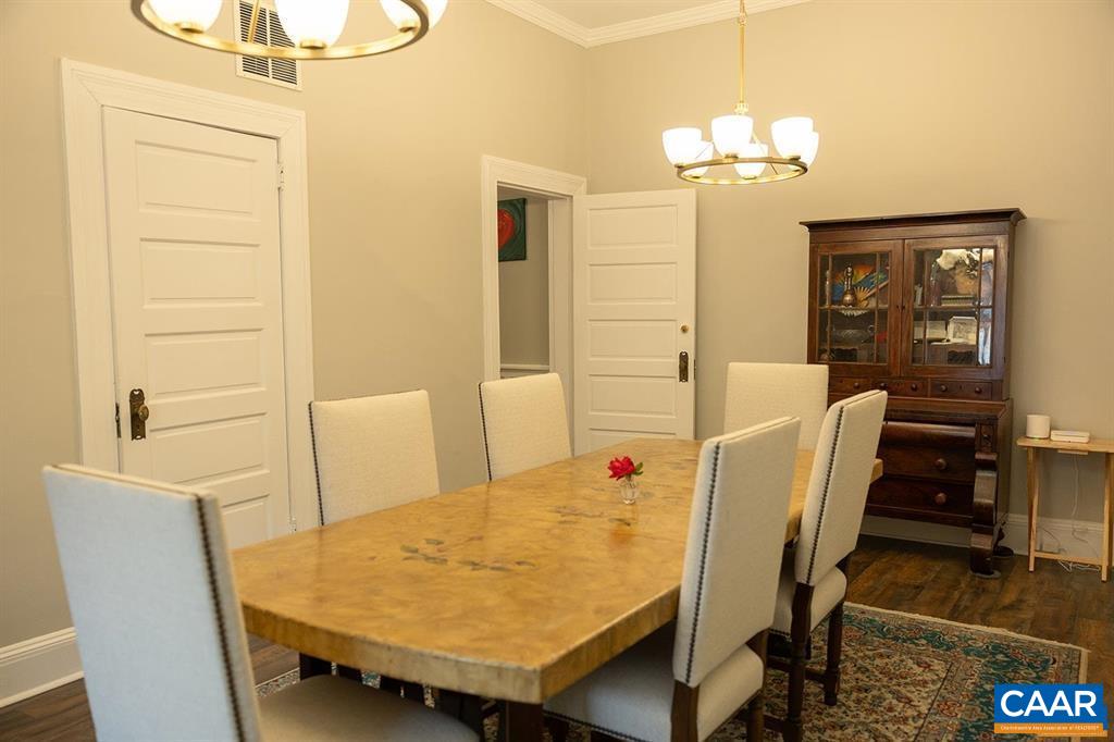 409 Park Street Charlottesville, VA 22902 - Photo 24 of 58 a view of a dining room with furniture and chandelier