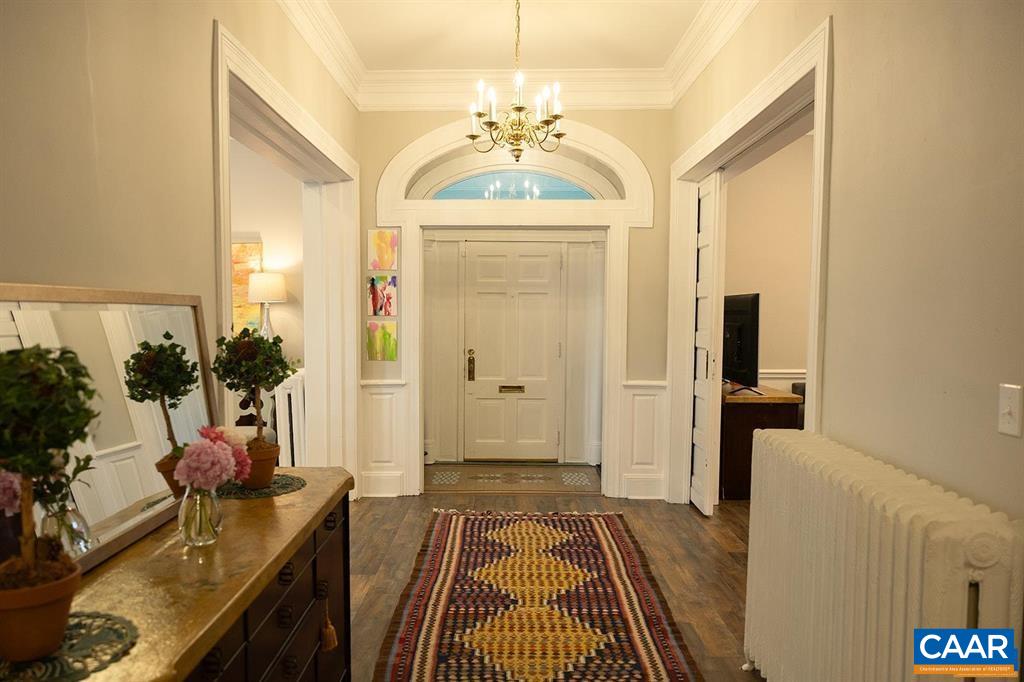 409 Park Street Charlottesville, VA 22902 - Photo 4 of 58 a view of a hallway to a livingroom with furniture