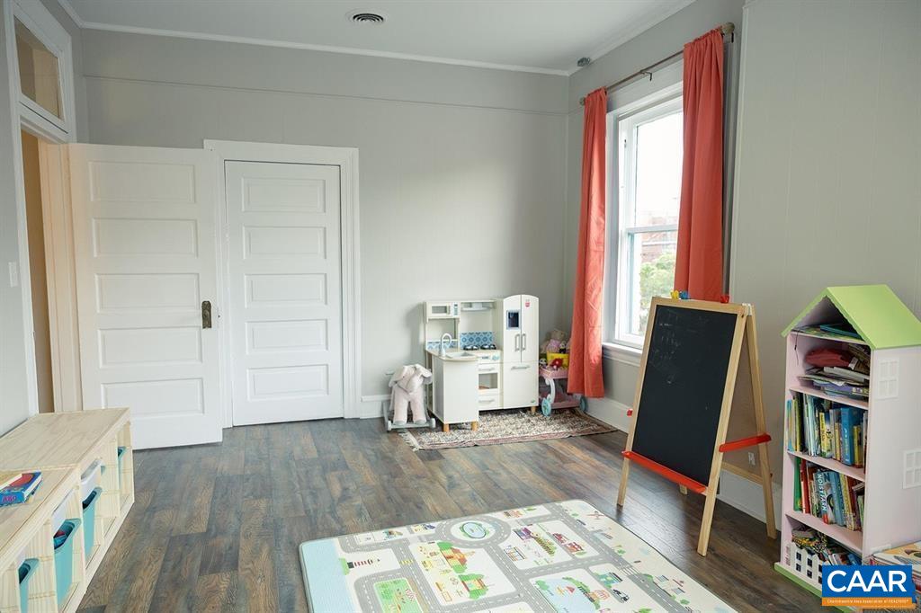409 Park Street Charlottesville, VA 22902 - Photo 45 of 58 a living room with furniture and a wooden floor