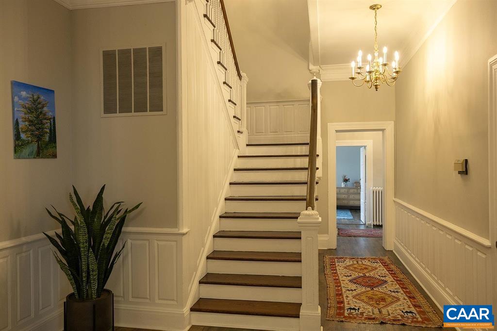 409 Park Street Charlottesville, VA 22902 - Photo 52 of 58 a view of a hallway with wooden floor and staircase