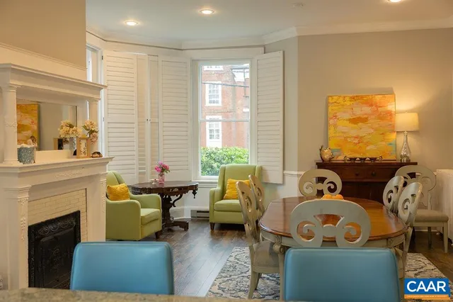 a view of a dining room with furniture and chandelier