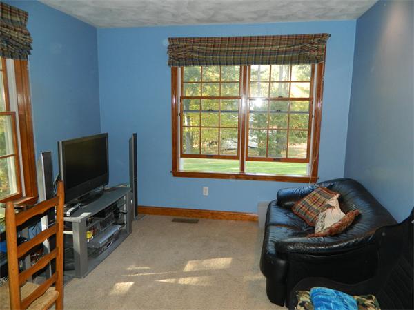 41 Highland Road Boxford, MA 01921 - Photo 8 of 18 a living room with furniture and a flat screen tv