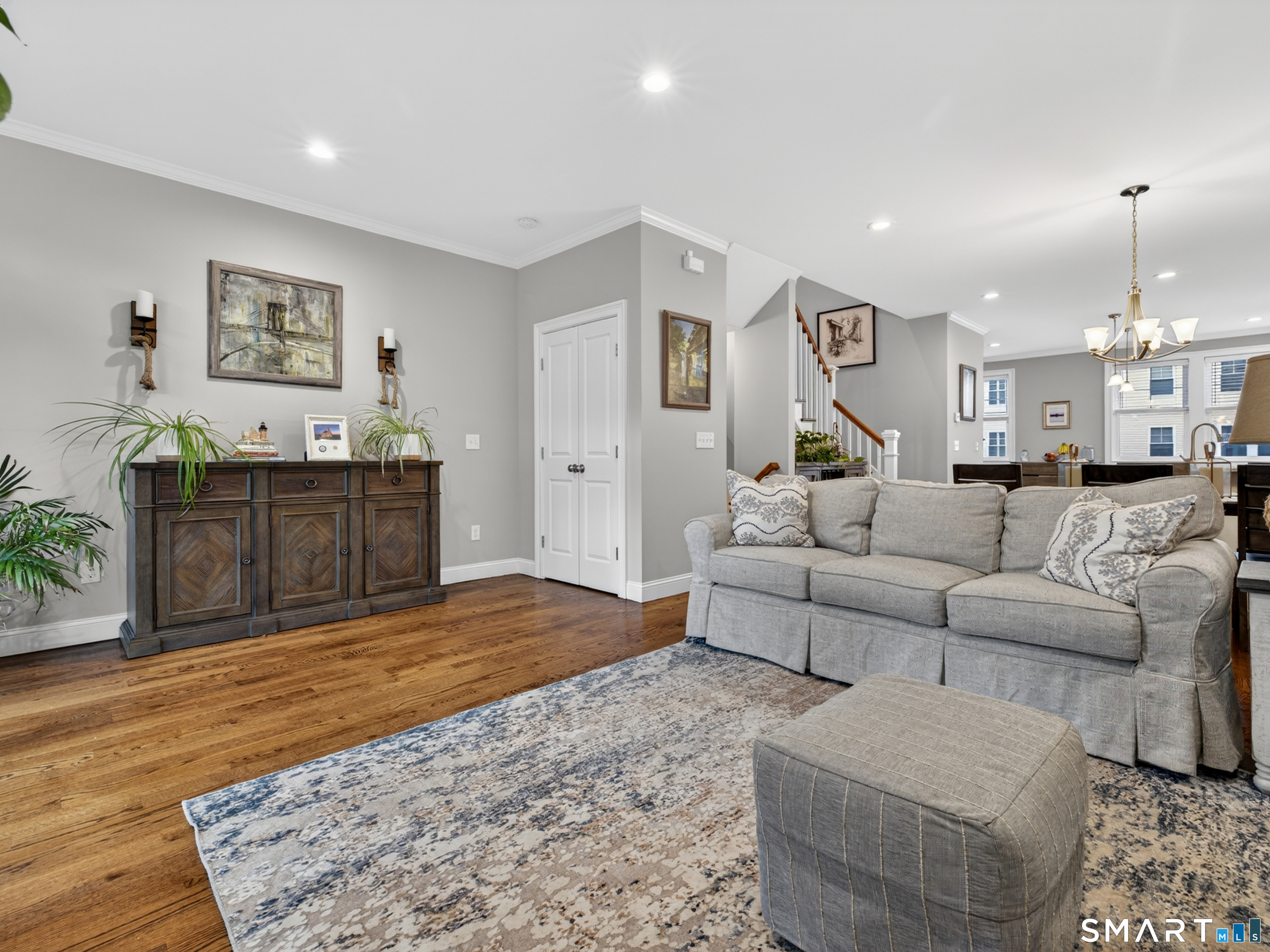 34 Village Crossing, Unit 34 Niantic, CT 06357 - Photo 9 of 38 a living room with furniture and wooden floor