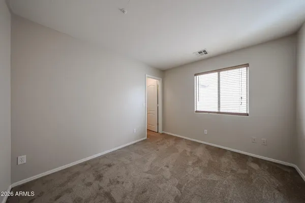 a bathroom with a sink vanity mirror bathtub and toilet