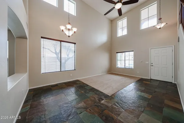 a view of a hallway with wooden floor and entryway