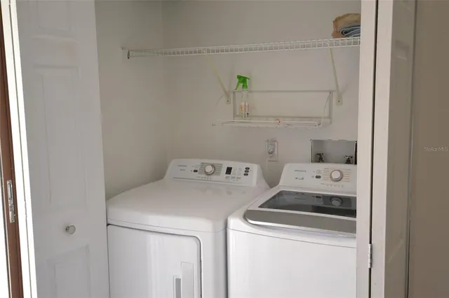 a utility room with dryer and washer