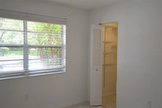 a view of a room that has a window in it