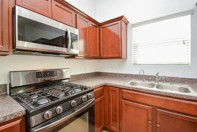 a kitchen with a stove and a microwave