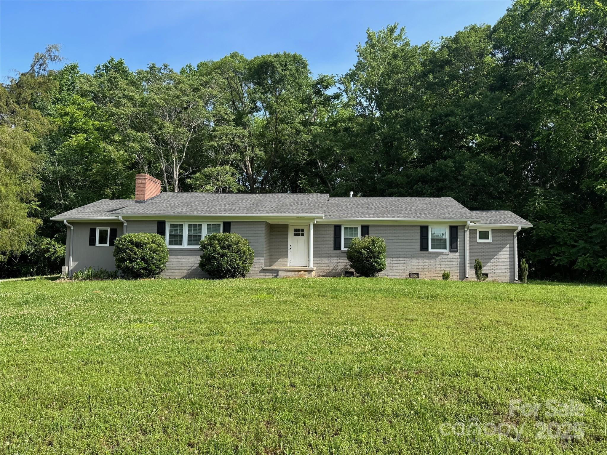 7860 Henry Harris Road Fort Mill, SC 29707 - Photo 1 of 31 a front view of a house with a garden