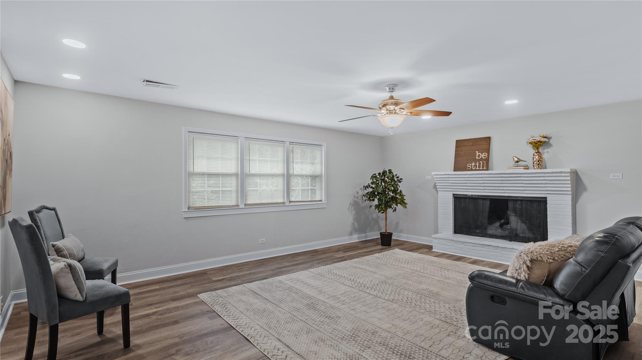 7860 Henry Harris Road Fort Mill, SC 29707 - Photo 12 of 31 a living room with furniture and a fireplace
