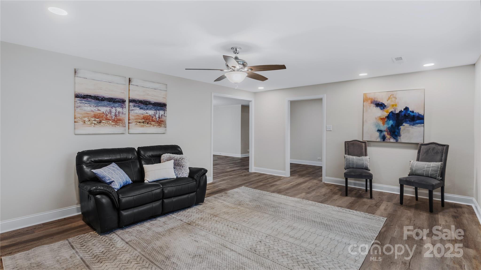 7860 Henry Harris Road Fort Mill, SC 29707 - Photo 14 of 31 a living room with furniture and a ceiling fan