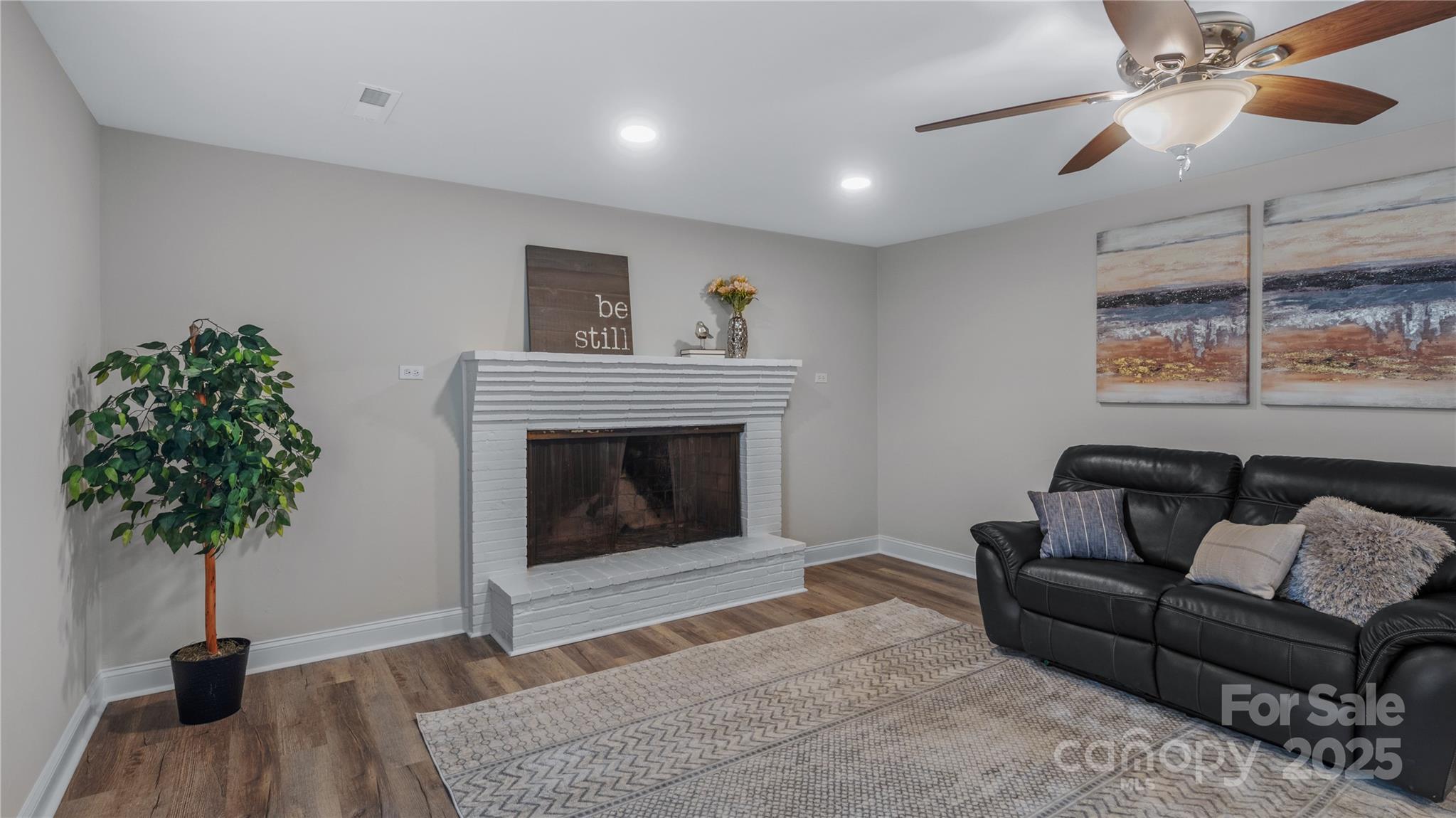 7860 Henry Harris Road Fort Mill, SC 29707 - Photo 15 of 31 a living room with furniture and a potted plant