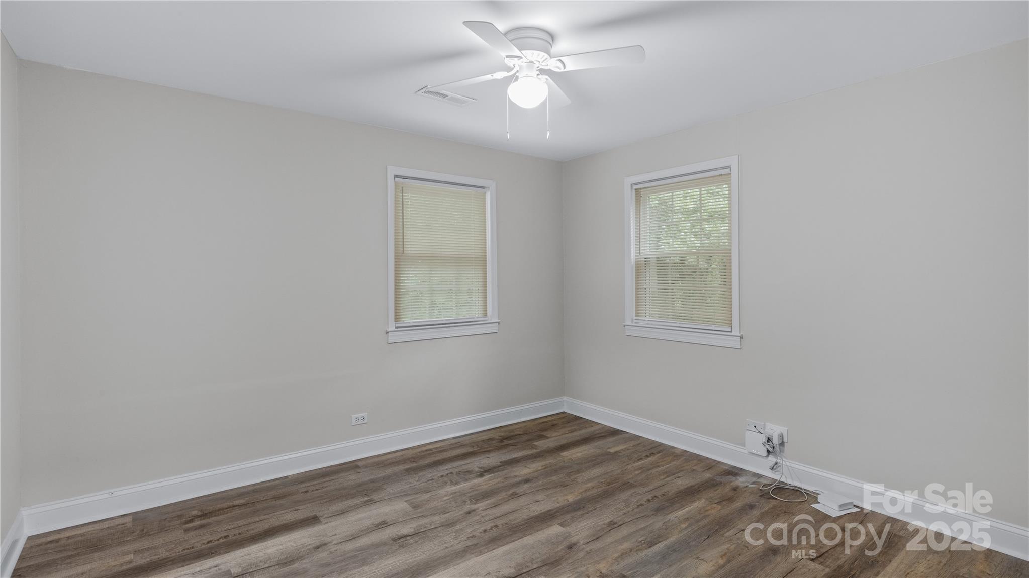 7860 Henry Harris Road Fort Mill, SC 29707 - Photo 17 of 31 a view of a room with wooden floor and a window