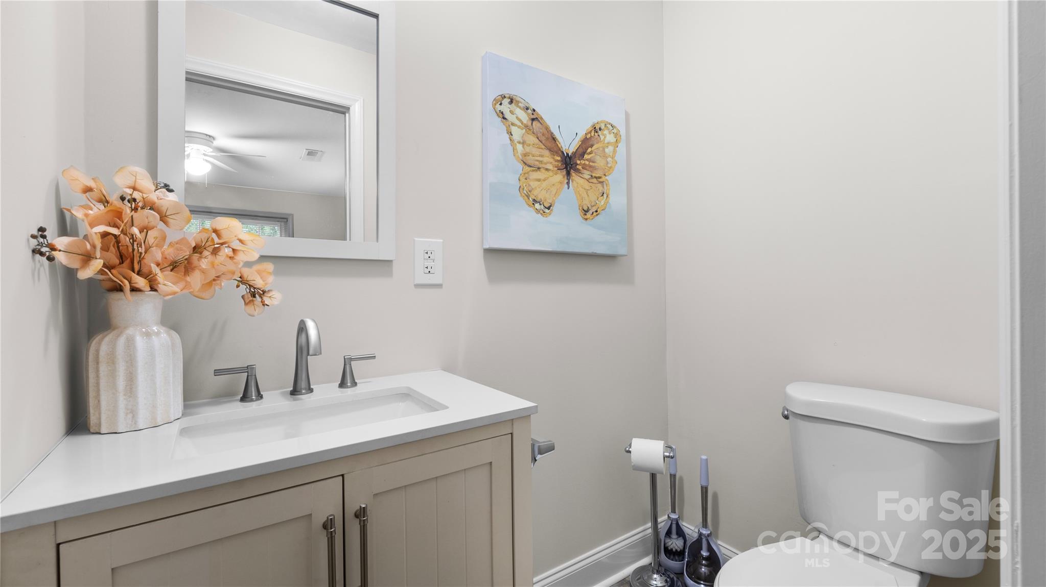 7860 Henry Harris Road Fort Mill, SC 29707 - Photo 18 of 31 a bathroom with a sink mirror vanity and toilet