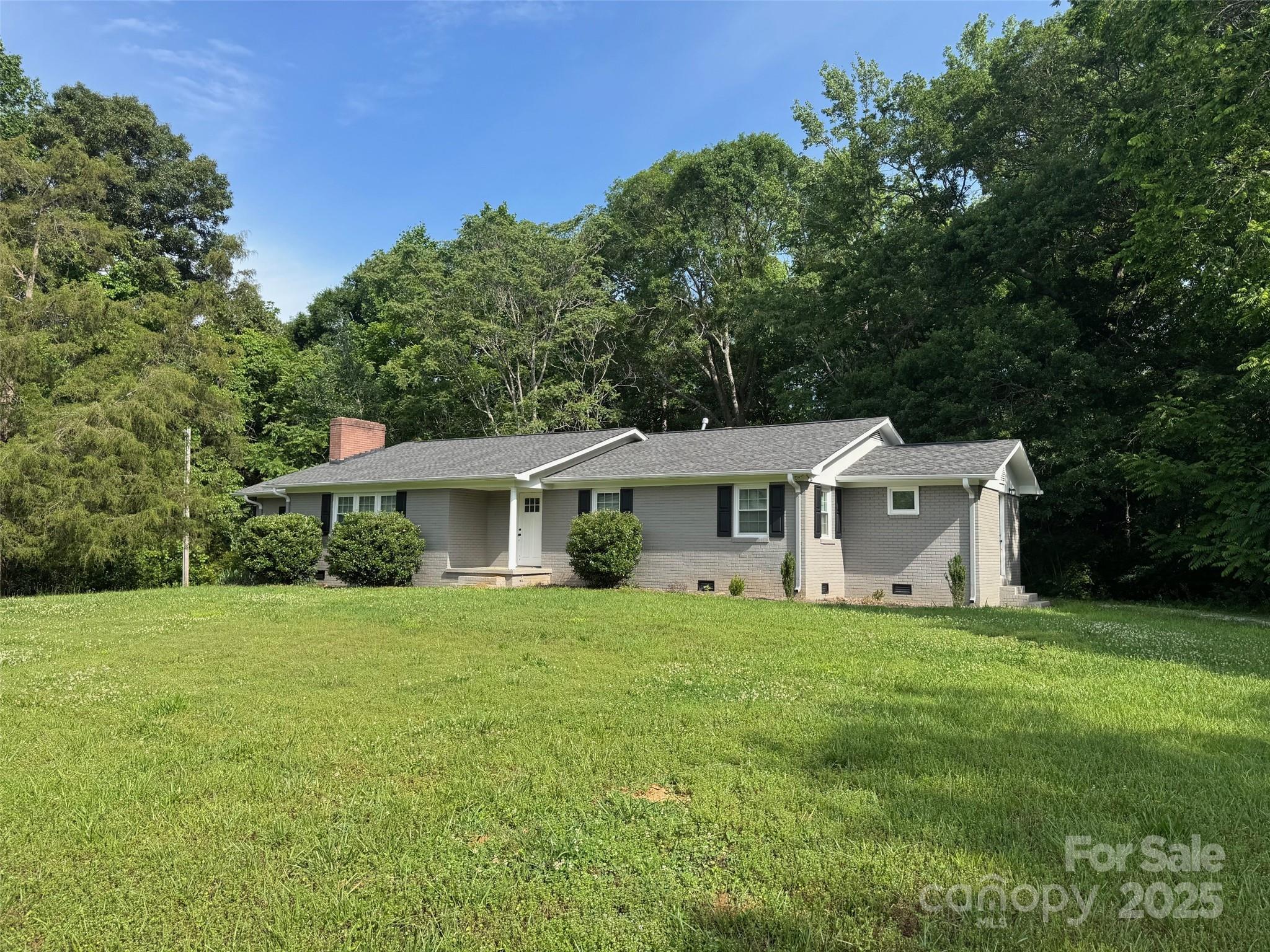 7860 Henry Harris Road Fort Mill, SC 29707 - Photo 30 of 31 a view of a house with a yard