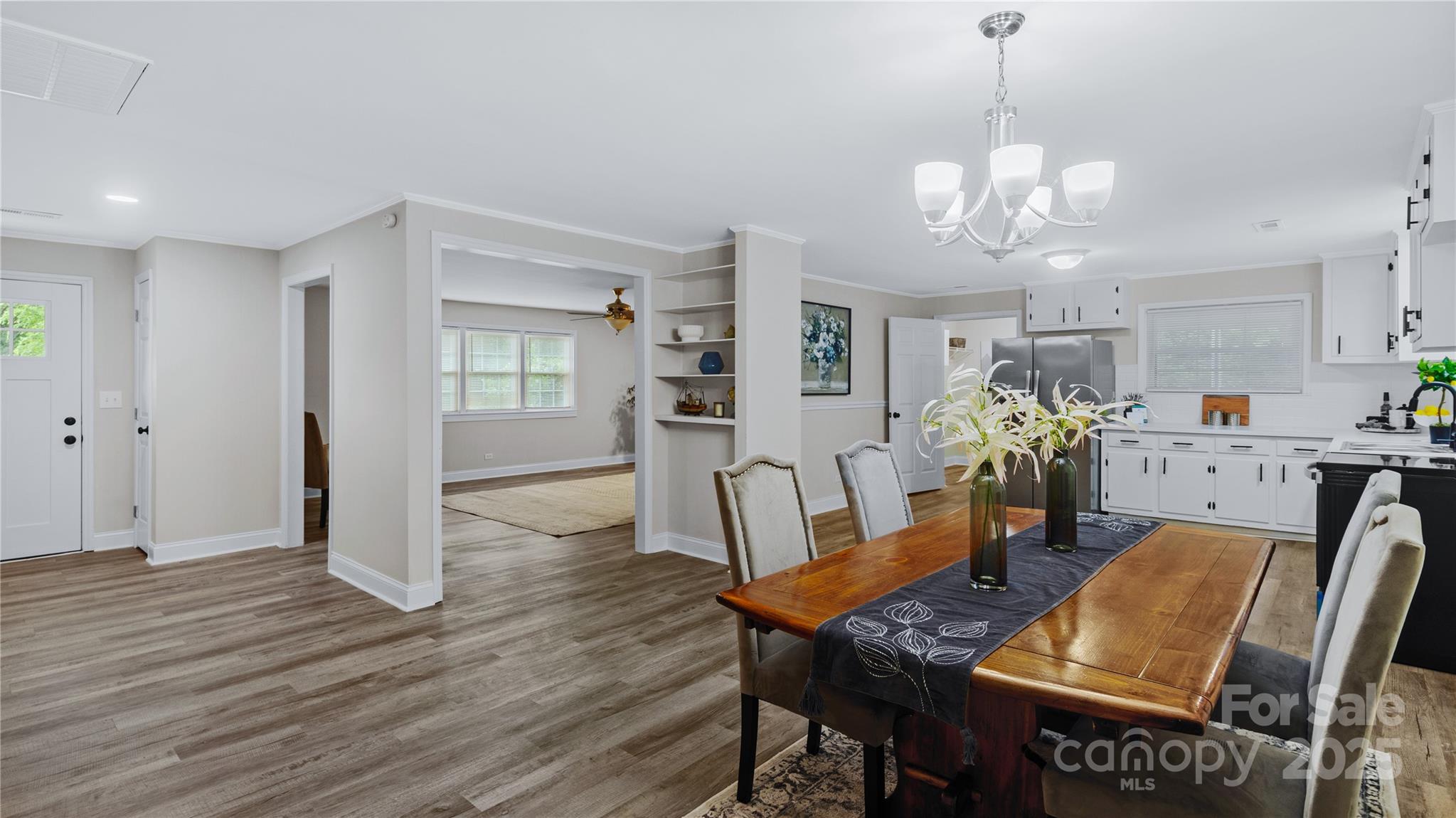 7860 Henry Harris Road Fort Mill, SC 29707 - Photo 4 of 31 a view of a dining room with furniture and wooden floor